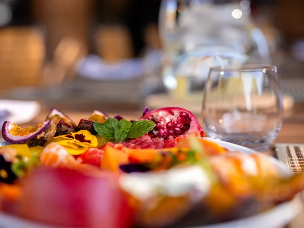 A fresh fruit salad platter featuring colourful fruits served at Khamab Game Reserve.
